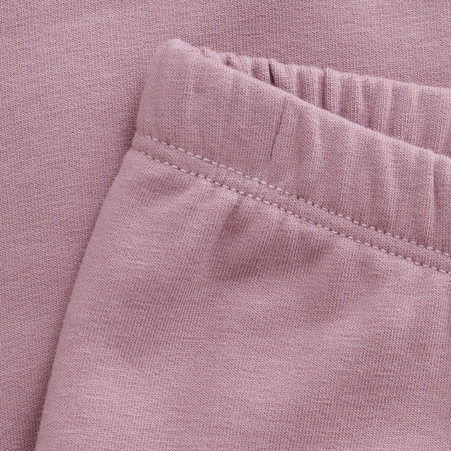 Entdecken Sie die stylischen rosa Leggings von MINYMO, die Komfort und trendiges Design perfekt vereinen.