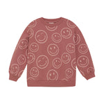 Dieses rosa Sweatshirt von MINYMO ist mit fröhlichen Smileys verziert und sorgt für gute Laune.