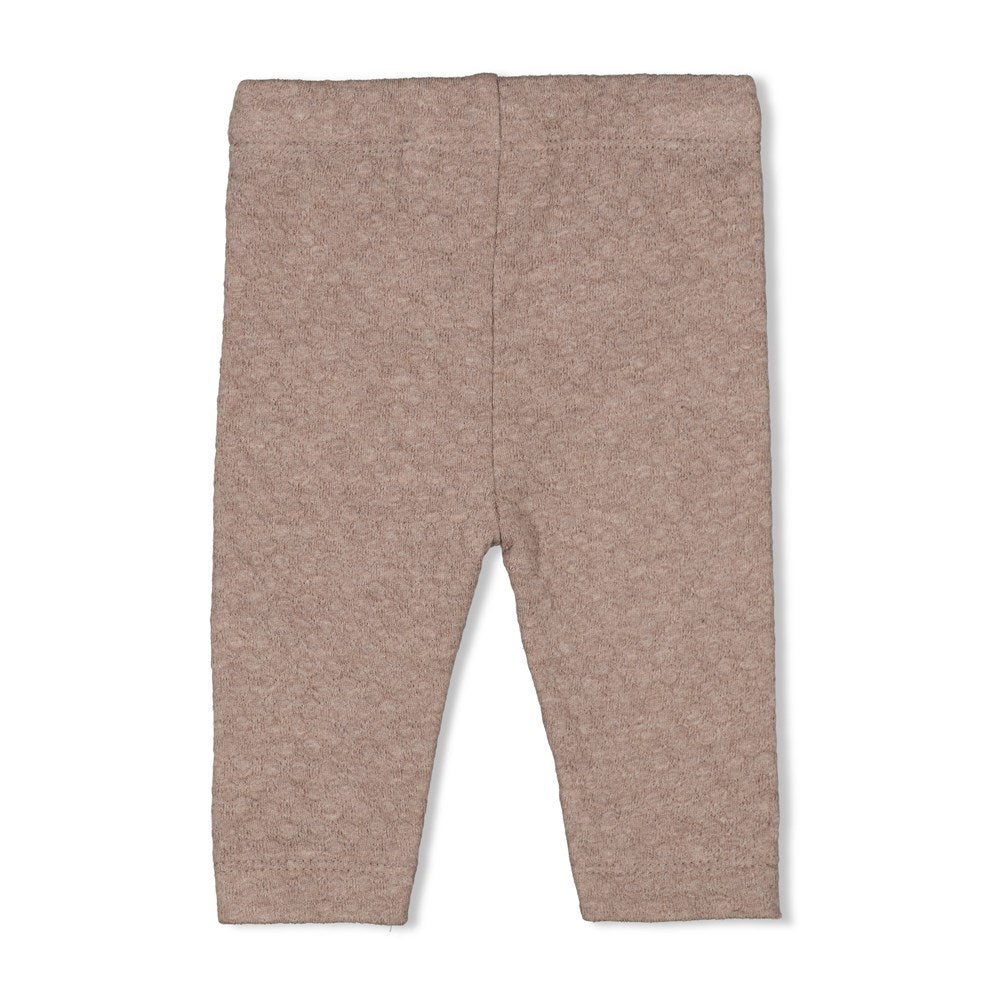 braunmelierte Leggings mit kleinem rosa Herz als Detail