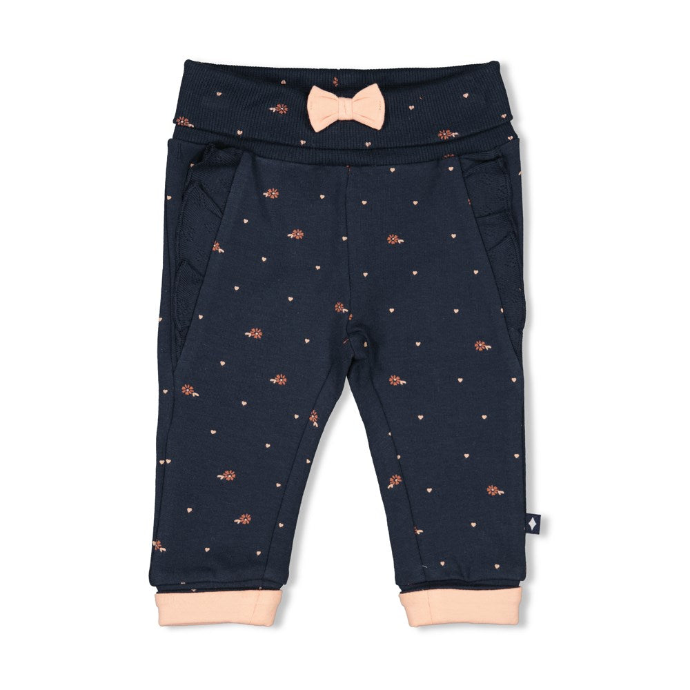dunkelblaue Hose mit Blümchen und Masche