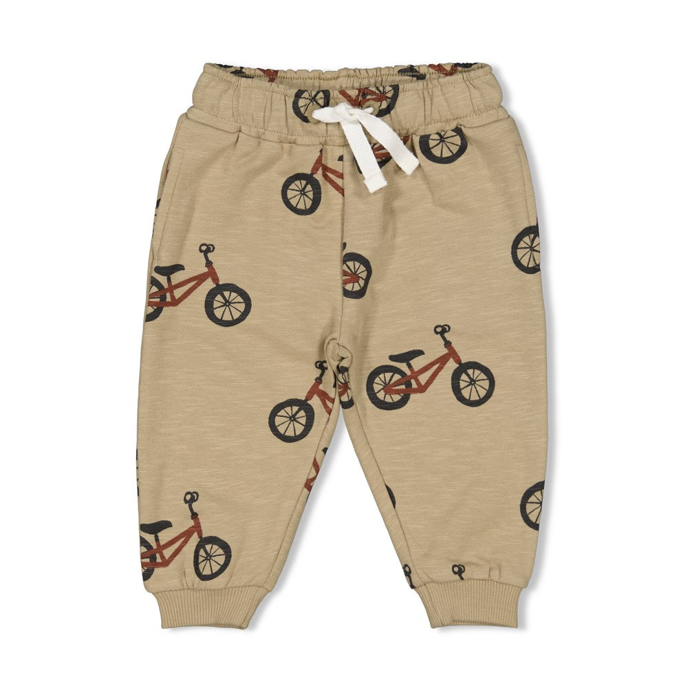 beige Hose mit Fahrradmotiv