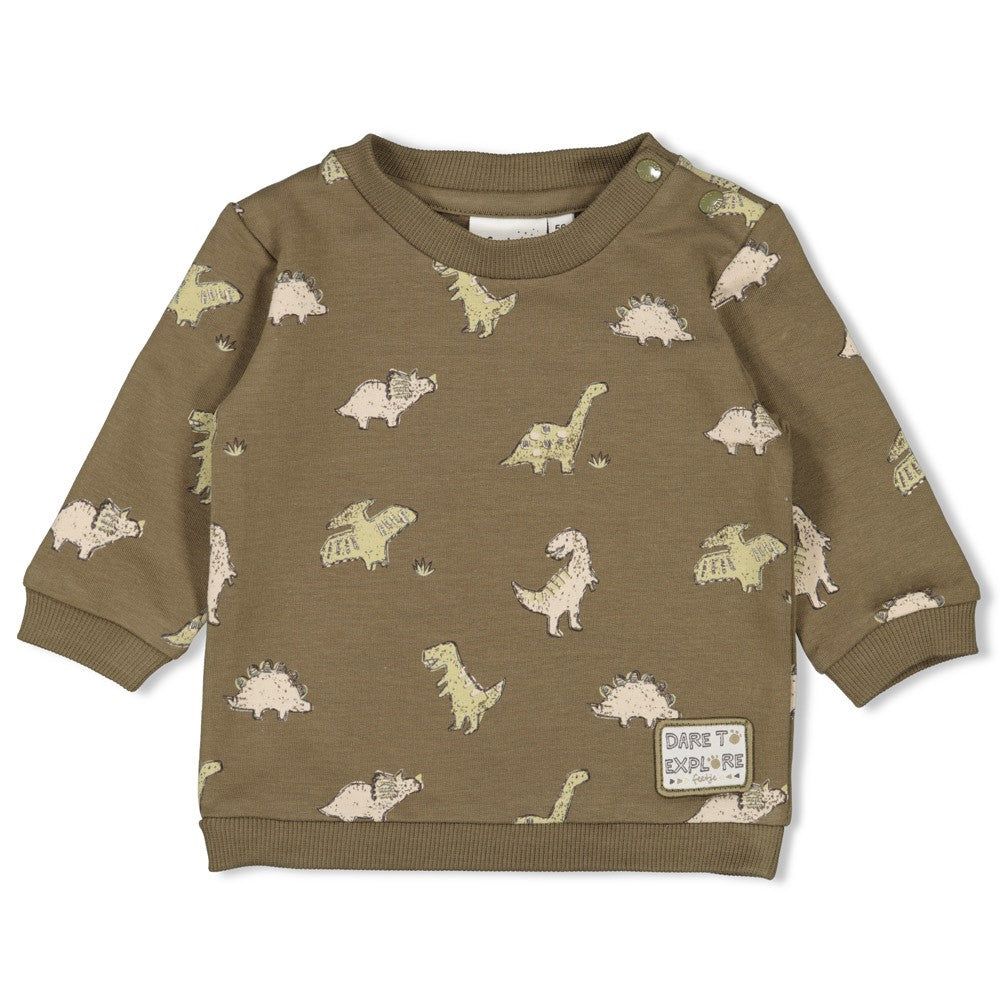 Dieser grüne Pullover aus der Rawrsome Kollektion von Feetje besticht durch einen durchgehenden Dinosaurier-Print und sorgt für einen verspielten Look.