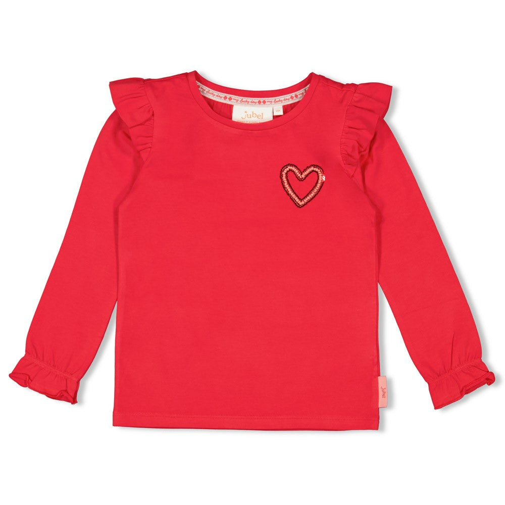 Dieses rote Langarmshirt aus der Queen Of Hearts Kollektion von Jubel besticht durch ein kleines Herzmotiv und verspielte Rüschen an den Ärmeln. Es verbindet Komfort mit einem charmanten Design, das jeden Tag verschönert.