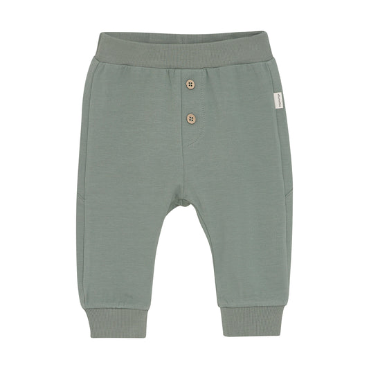 Entdecken Sie die bequemen Sweatpants von MINYMO, verziert mit einem auffälligen Dinosaurier-Motiv – perfekt für stilbewusste Kids, die Komfort und Spaß lieben.&nbsp;