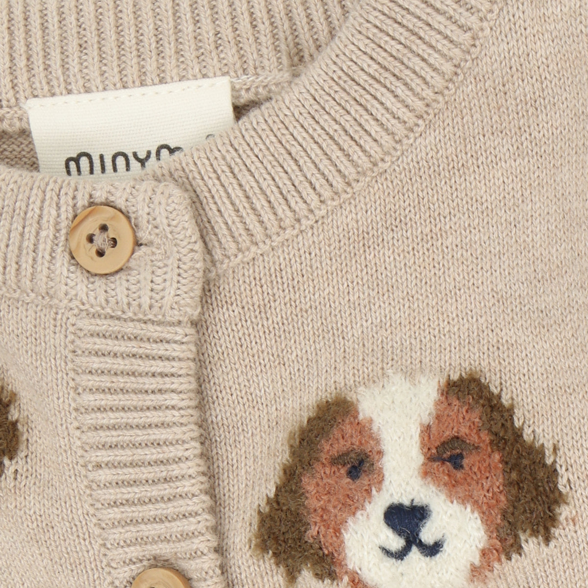 Gemütlicher beiger Knit Cardigan von Minymo mit niedlichen Hunde Motiven – perfekt für kleine Tierfreunde, die es kuschelig lieben.