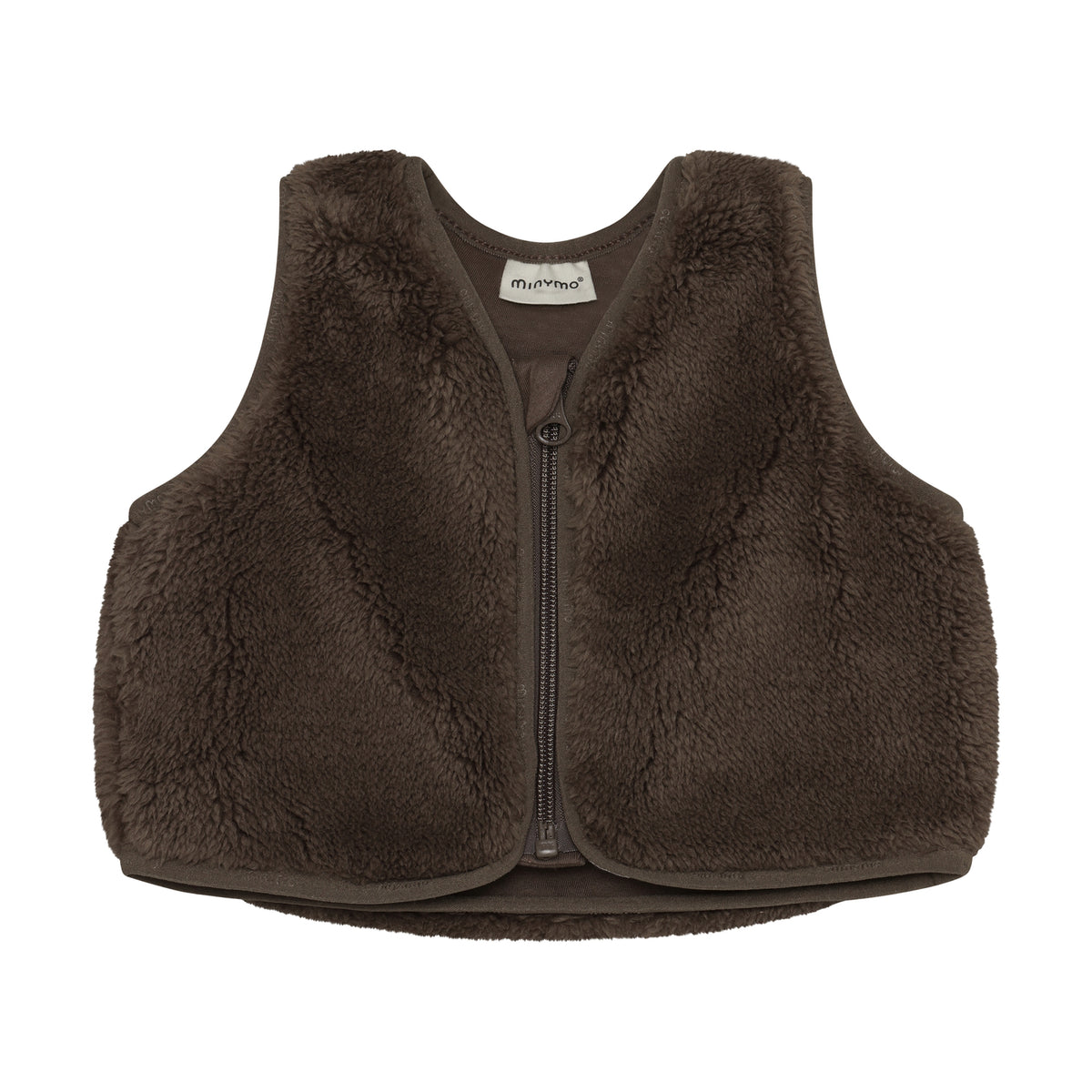 Weiches Teddy-Vest von Minymo aus 100% Polyester – perfekt für gemütliche Tage. Das kuschelige Material bietet maximalen Komfort und ist pflegeleicht. Ideal als Layering-Piece oder zum Entspannen zu Hause.