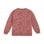 Dieses rosa Sweatshirt von MINYMO ist mit fröhlichen Smileys verziert und sorgt für gute Laune.
