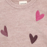Ein weiches Knit-Meisterwerk für kleine Fashionistas – dieser rosa Pullover von Minymo besticht durch sein charmantes Herzmuster und die hochwertige Materialmischung. Perfekt für gemütliche Tage und elegante Momente.