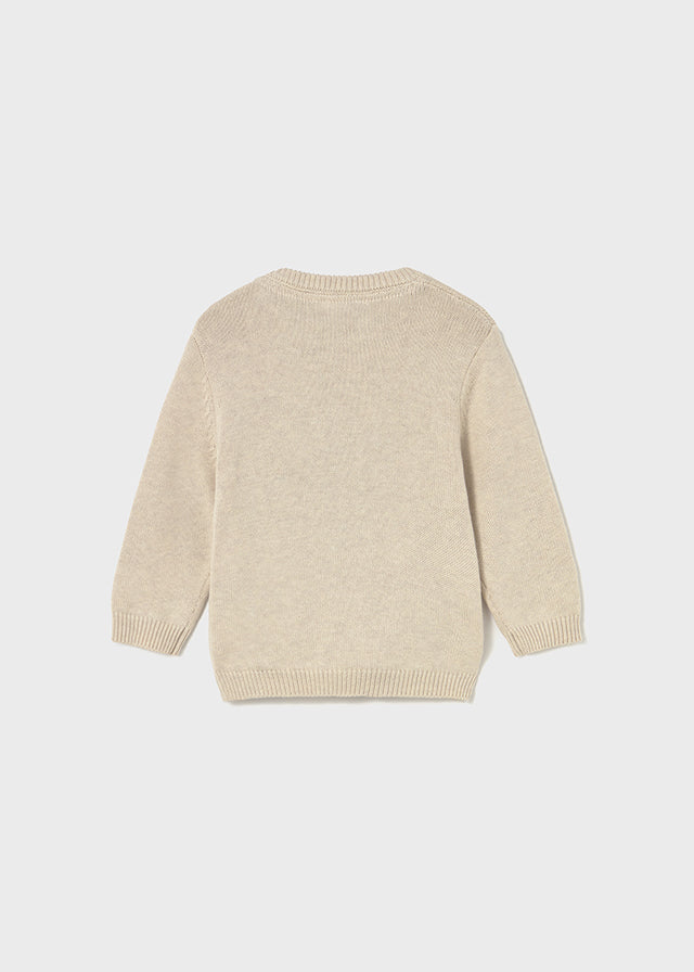 Dieser beigefarbene Pullover von Mayoral besticht durch ein niedliches Bärenmotiv und sorgt für ein charmantes, kindgerechtes Design.