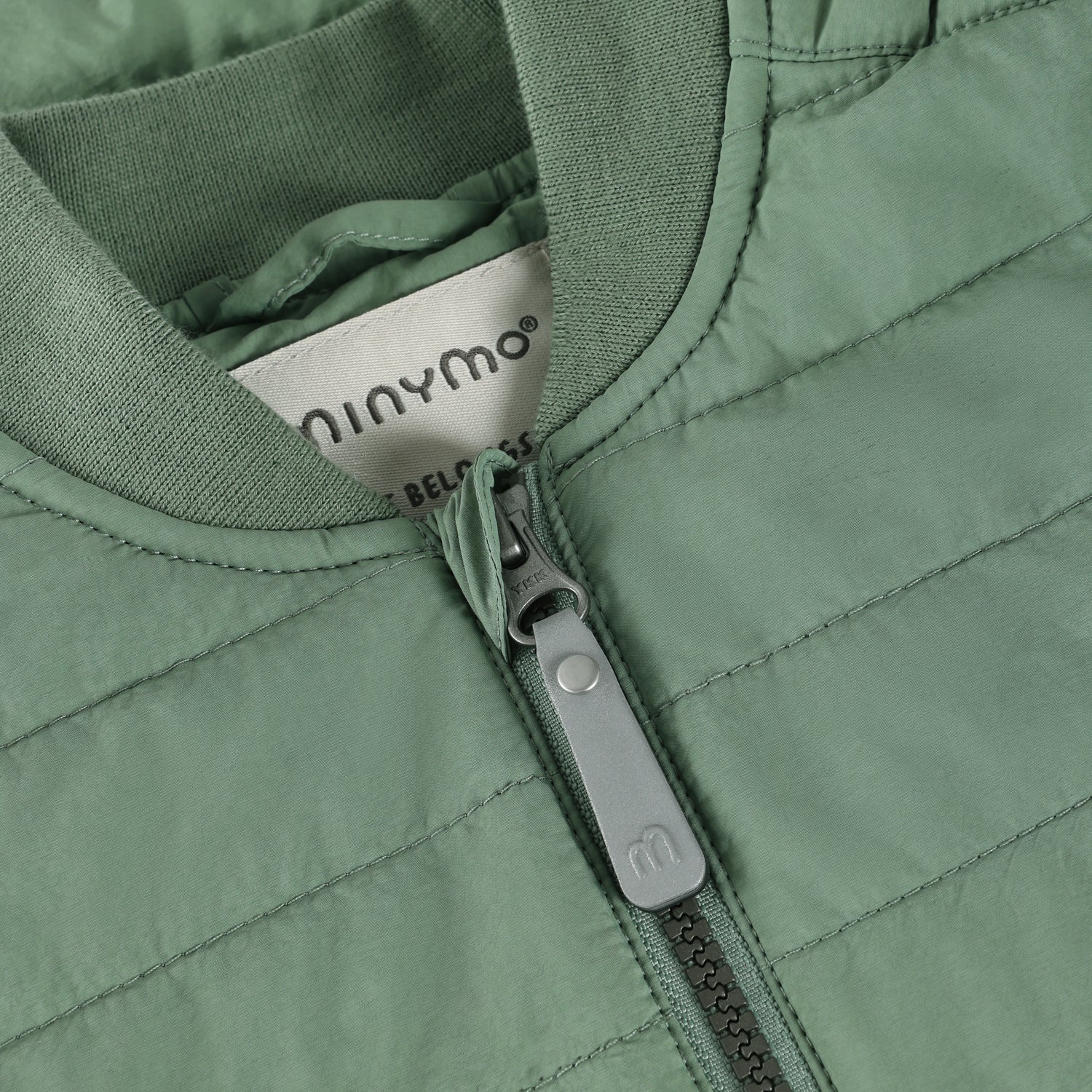 Grüne wärmende Weste von MINYMO.