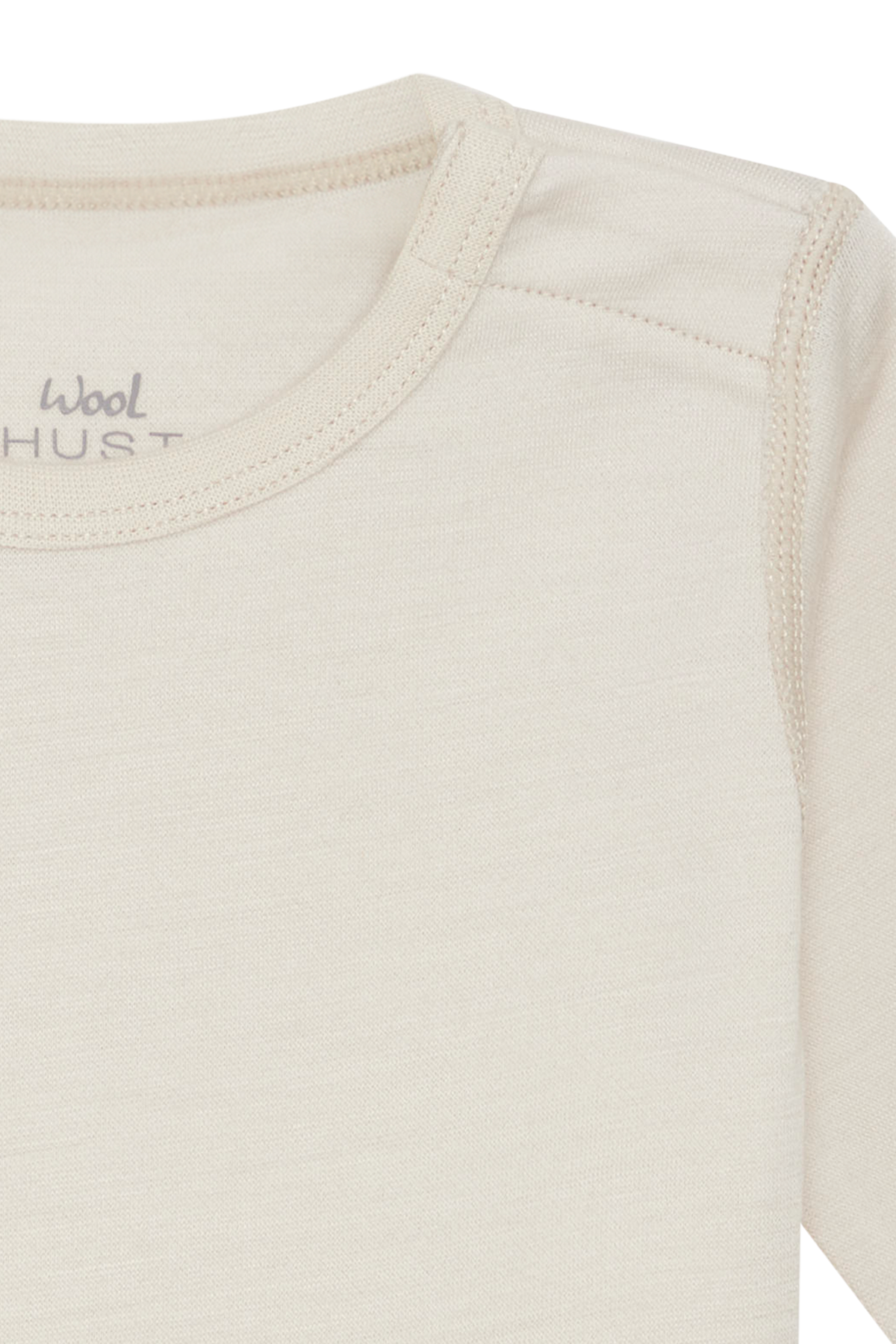 Weißer Langarm-Body aus hochwertiger Wolle von Hust &amp; Claire, der Komfort und Wärme perfekt vereint.