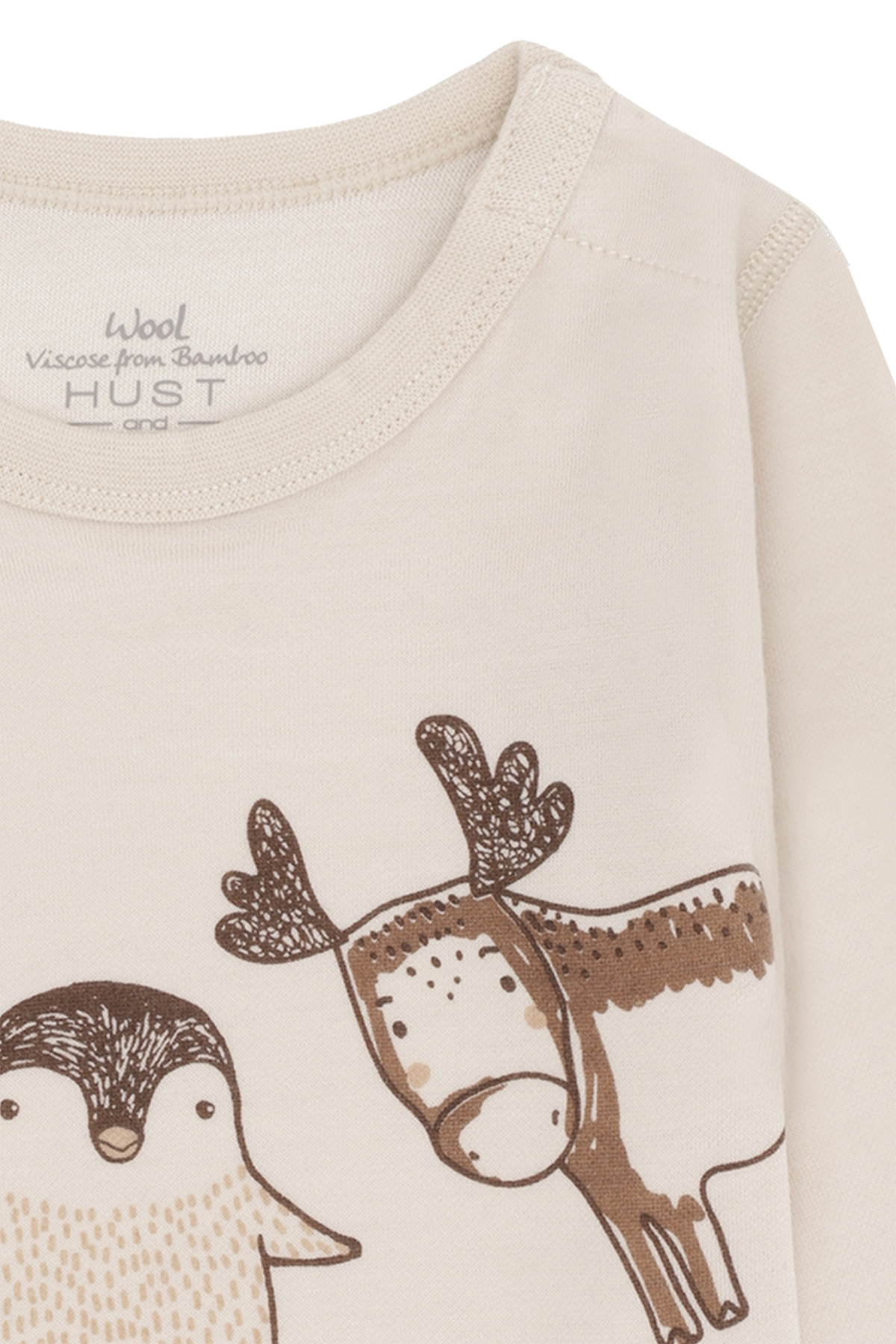 Der cremefarbene Body von Hust &amp; Claire überzeugt mit einem liebevollen Wintertier-Design und sorgt für wohligen Komfort.