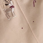 Diese beigen Leggings von Fixoni sind mit zarten Weihnachtsmotiven verziert und bringen festliche Stimmung in Ihren Alltag.