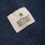 Diese dunkelblaue Balaclava von Huttelihut ist ideal, um Ihr Kind bei kalten Temperaturen warm und geschützt zu halten.