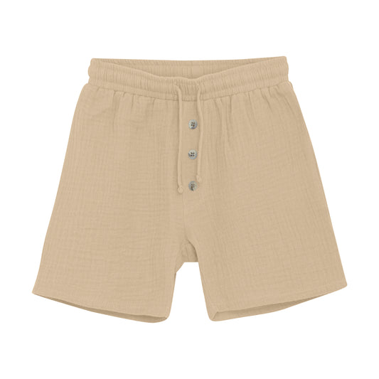 Diese kurze beige Musselin-Short bietet ein leichtes, atmungsaktives Tragegefühl – perfekt für warme Tage. Ihr weicher Stoff sorgt für angenehmen Komfort, während der lockere Schnitt Bewegungsfreiheit garantiert.&nbsp;