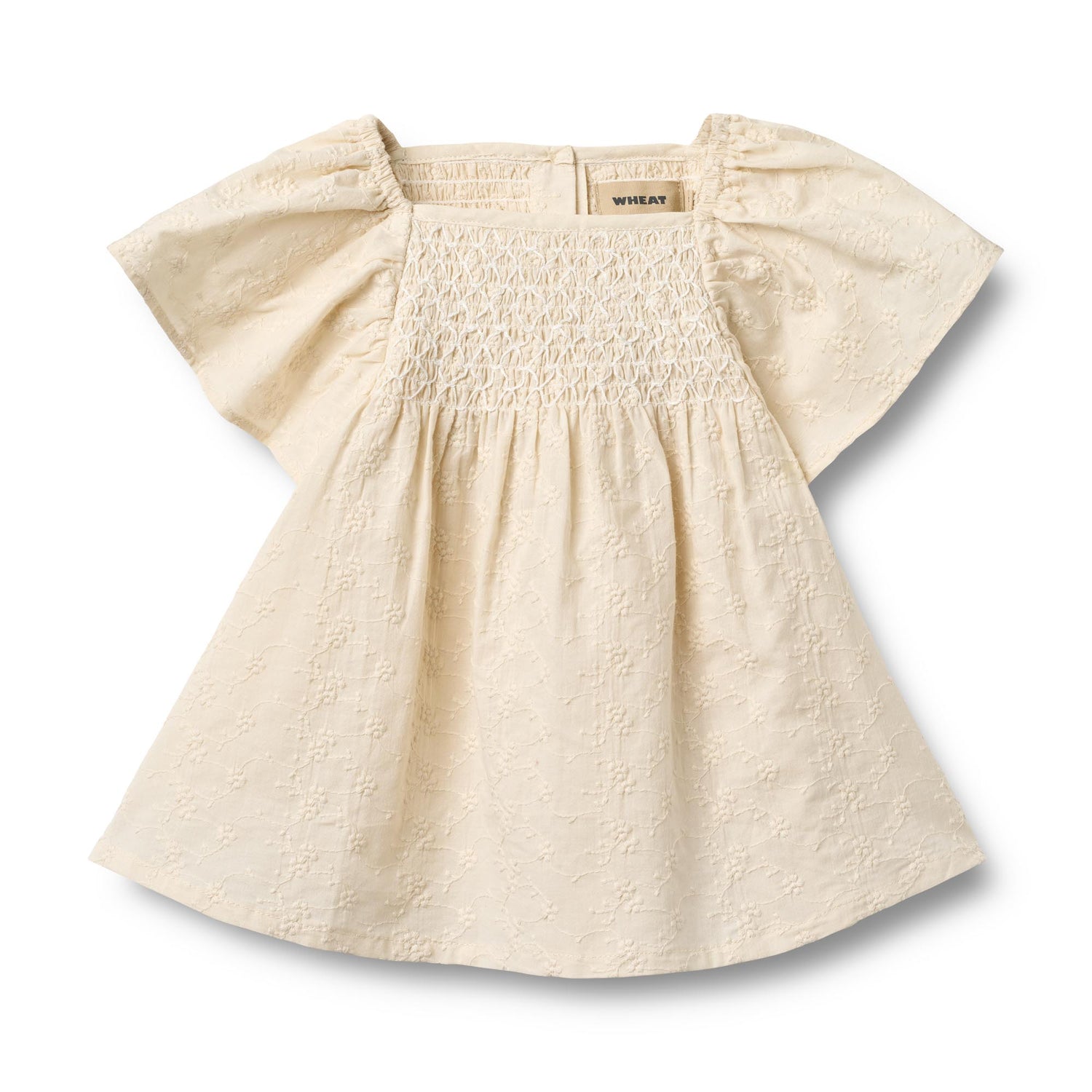 Elegantes Sommerkleid von WHEAT aus 100% Bio-Baumwolle. Das Dress S/S Elva besticht durch seine luftige Leichtigkeit und natürliche Materialqualität. Perfekt für warme Tage – angenehm zu tragen und umweltbewusst produziert. Ein zeitloses Basics-Piece für deinen Kleiderschrank.