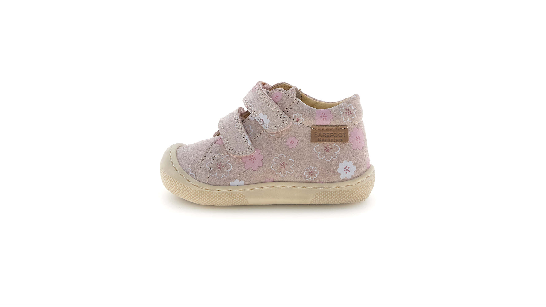Diese Barfußschuhe von Naturino kombinieren Komfort und Stil mit einem modernen Design. Das Obermaterial aus Leder und Velours verleiht einen markanten Look, während der Klettverschluss Praktikabilität gewährleistet. Das Innenfutter und die Einlegesohle, beide aus Leder, sorgen für ein hochwertiges Gefühl beim Kontakt mit dem Fuß. Perfekt, um deine Tage mit einem Hauch von Eleganz zu begleiten.