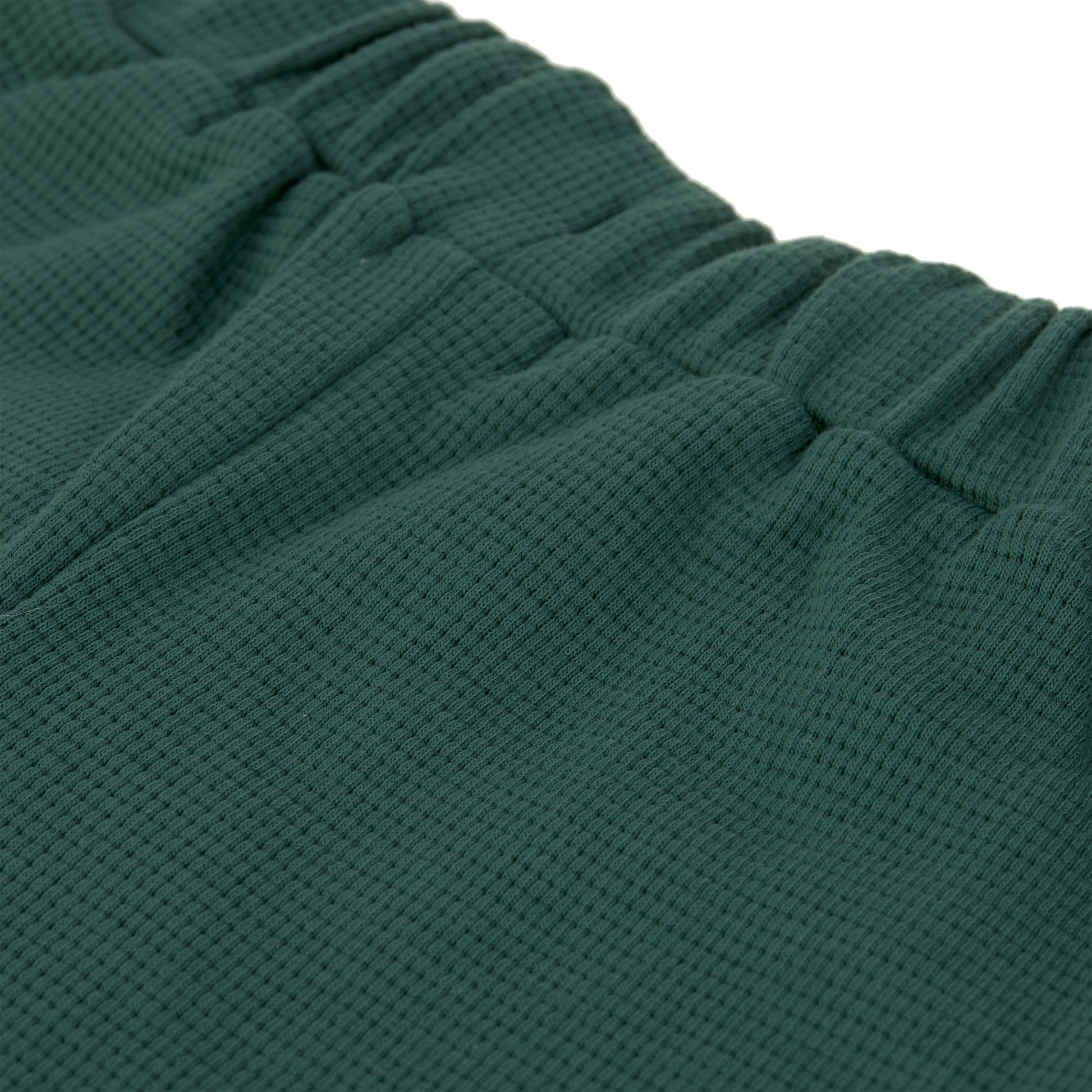 Die stylishe Kinder Shorts Waffle in Grün macht das Outfit der Kids zum Hingucker! Die GOTS-zertifizierte, weiche Cargoshorts aus Baumwolle (bio) rundet in modischen Farben und mit gestrickter Waffelstruktur jeden Look ab.