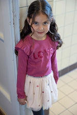 Dieses rosa Langarmshirt mit funkelndem Love-Aufdruck stammt aus der Shine Bright Kollektion von Jubel und bringt strahlenden Glanz in deinen Alltag.