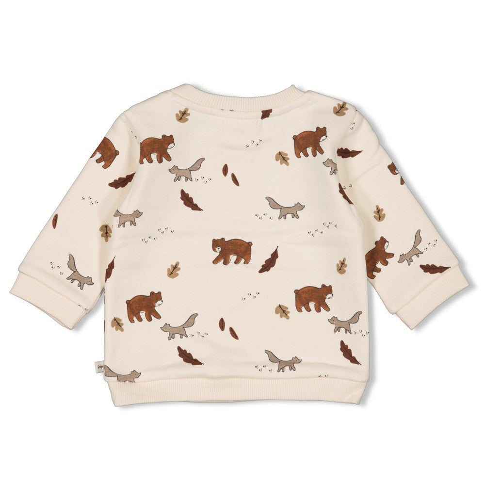 Dieser beige Pullover aus der Wild World Kollektion von Feetje besticht durch ein durchgängiges Bärenmuster und verbindet stilvolle Eleganz mit einem Hauch von Naturverbundenheit.