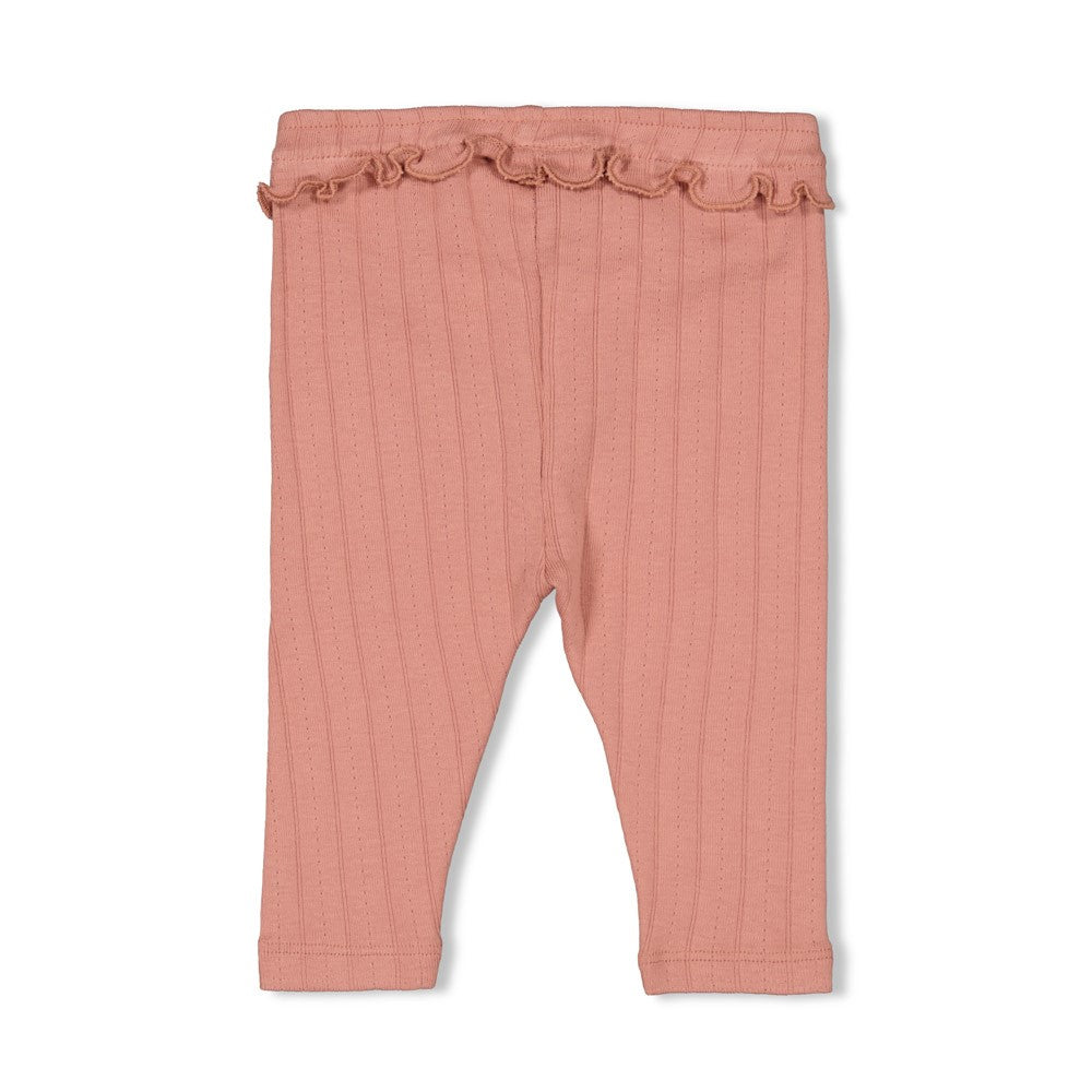Diese rosa Leggings mit Rippenstruktur aus der Woodland Bloom Kollektion von Feetje zeichnen sich durch einen verspielten Rüschenbund und eine zarte Schleife aus.